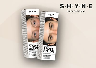 Zwei Produktverpackungen von SHYNE Professional Brow Color, eine in Dunkelblond und eine in Dunkelbraun, mit Abbildungen von Augenbrauen und der Aufschrift „Brow Color“