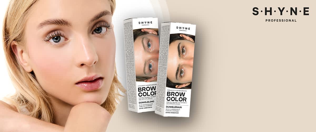 Zwei Produktverpackungen von SHYNE Professional Brow Color, eine in Dunkelblond und eine in Dunkelbraun, mit Abbildungen von Augenbrauen und der Aufschrift „Brow Color“