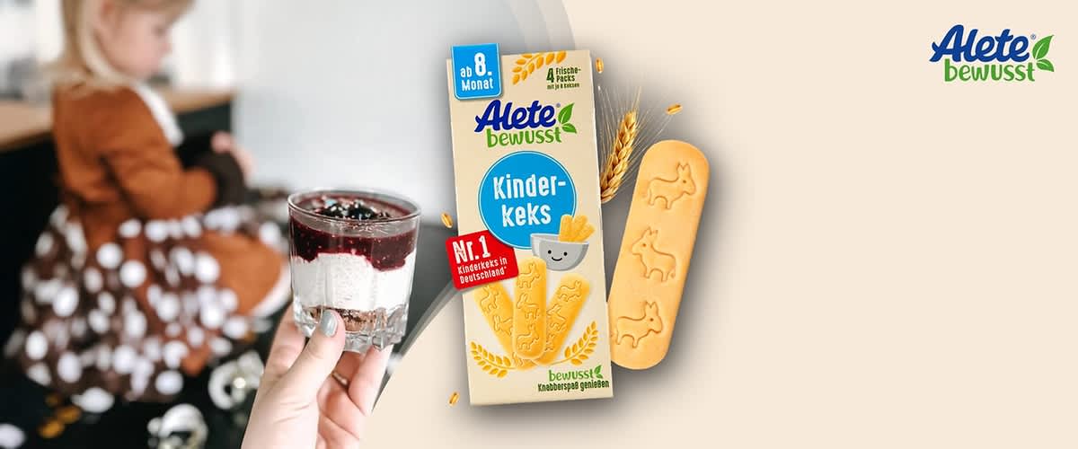 Eine Verpackung von Alete bewusst Kinder-Keks mit der Aufschrift „ab 8. Monat“ und „Nr. 1 Kinderkeks in Deutschland“, daneben ein Keks mit Tiermotiv, oben rechts das Alete bewusst Logo