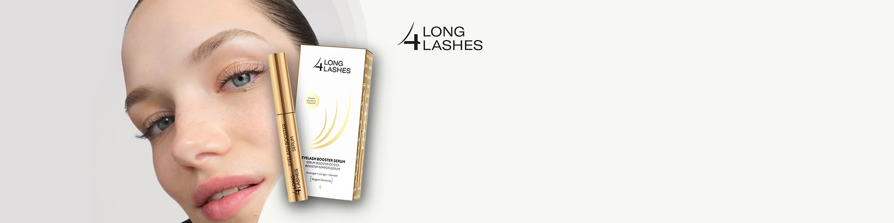 Eine goldene Tube und Verpackung mit der Aufschrift „Long 4 Lashes Eyelash Booster Serum“ und das Logo „LONG 4 LASHES“ in der oberen rechten Ecke