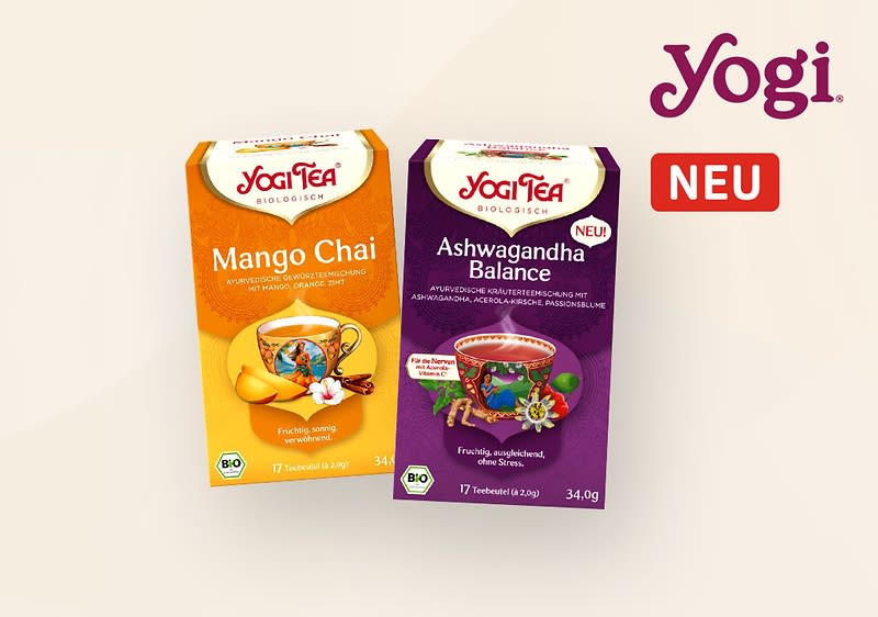 Zwei Teepackungen von Yogi Tea, links Mango Chai mit orangefarbenem Design und rechts Ashwagandha Balance mit violettem Design, beide mit Bio-Siegel und der Aufschrift „NEU“
