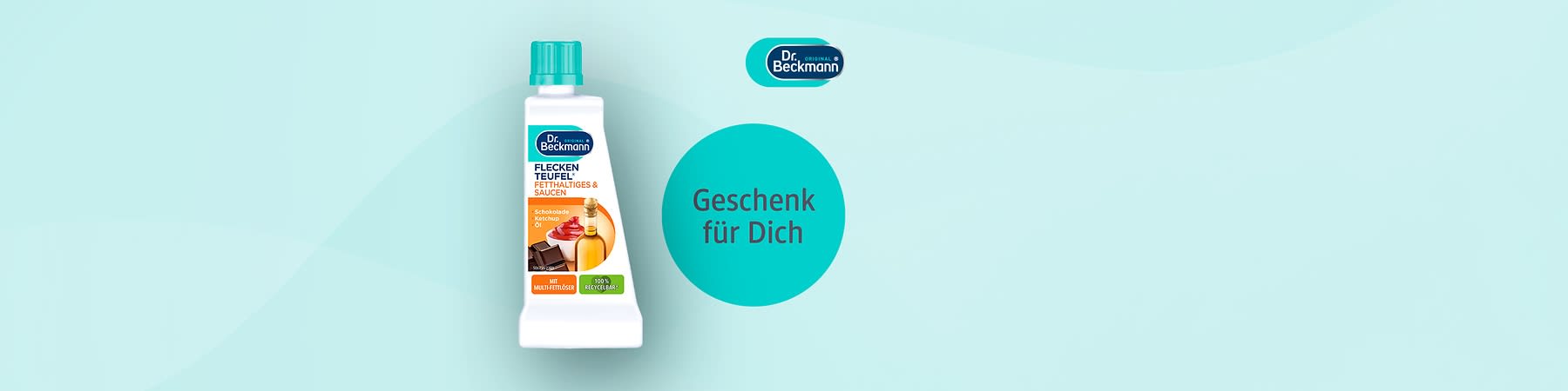 Eine weiße Flasche mit der Aufschrift „Dr. Beckmann Fleckenteufel Fett- und Saucenflecken“ und einem Bild von Ketchup und Öl, daneben ein Kreis mit dem Text „Geschenk für Dich“