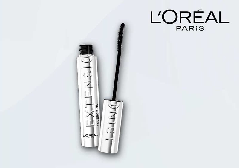 Eine silberne Mascara-Flasche mit der Aufschrift „EXTENSIL“ und einem schwarzen Bürstchen, daneben das Logo von L'Oréal Paris
