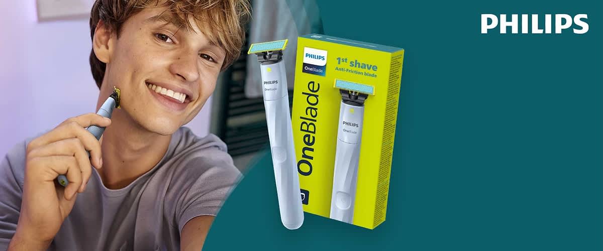 Eine Verpackung mit einem Philips OneBlade Rasierer und der Aufschrift „1st shave Anti-Friction blade“ in Gelb und Blau. Im Hintergrund das Philips-Logo.