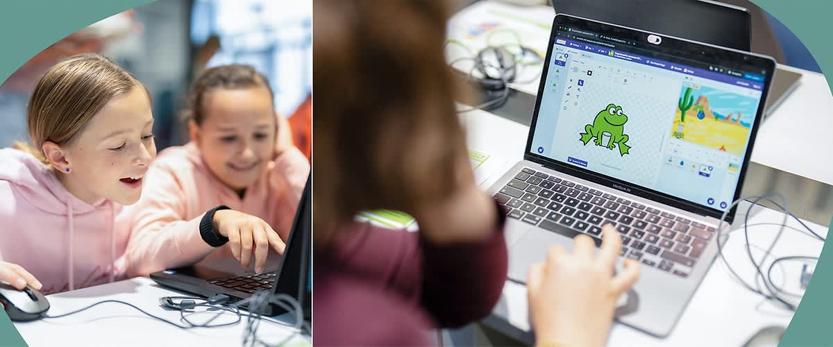 Zwei Kinder arbeiten an einem Laptop, während eine Person auf einem anderen Laptop ein Programm mit einem grünen Frosch und einer Wüstenlandschaft betrachtet.
