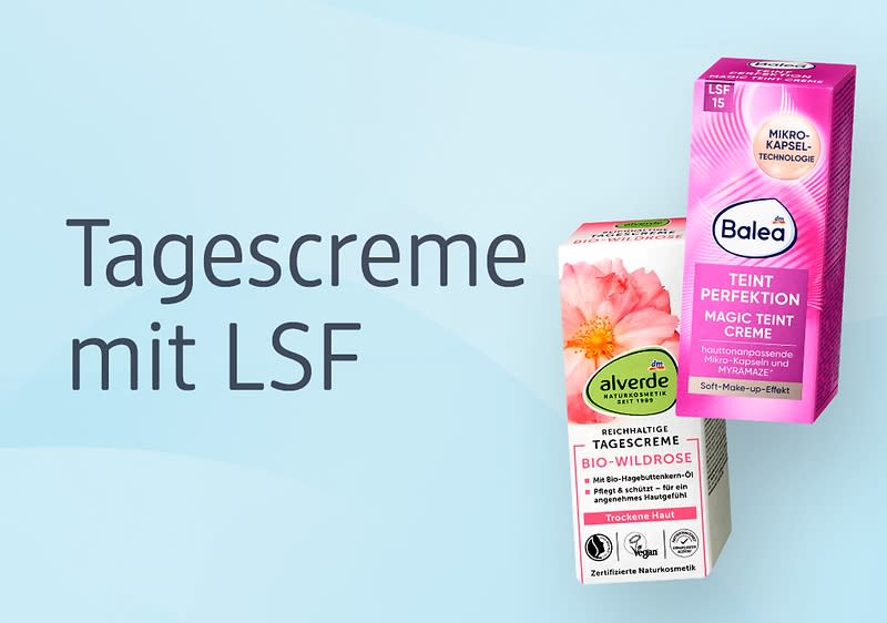 Hellblauer Hintergrund mit dem Text „Tagescreme mit LSF“ links und rechts zwei Produktverpackungen; oben rechts eine pink-lilafarbene Balea Perfection Magic Teint Creme Box mit dem Balea-Logo, links darunter eine beige-grüne alverde Tagescreme-Box mit Blumenmotiv und der Aufschrift „Bio-Wildrose“ sowie Symbolen für Naturkosmetik