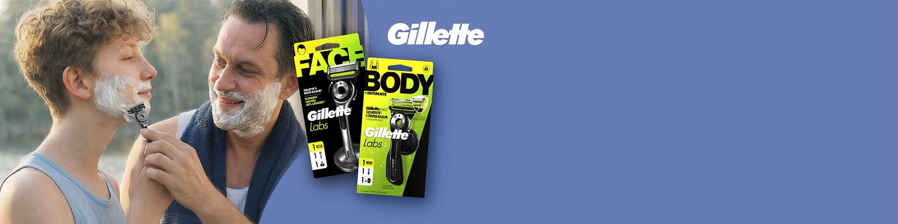 Zwei Männer stehen draußen neben einem Wohnmobil, der vordere rasiert sich mit einem Handrasierer; rechts zwei grün-schwarze Verpackungen von Gillette Labs mit den Aufschriften FACE und BODY sowie dem Gillette-Logo auf hellblauem Hintergrund