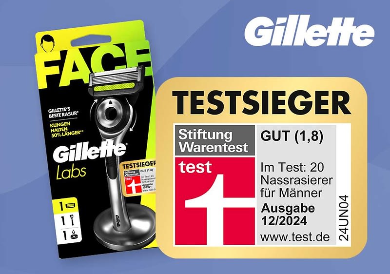 Produktverpackung eines Gillette Rasierers mit schwarzem Griff links und großem Schriftzug „FACE“ in Gelb oben links, rechts daneben ein beige-goldenes Label mit der Aufschrift „TESTSIEGER“, darunter das Stiftung Warentest-Logo, Bewertung „GUT (1,8)“, Text „Im Test: 20 Nassrasierer für Männer Ausgabe 12/2024“ und die Website „www.test.de“