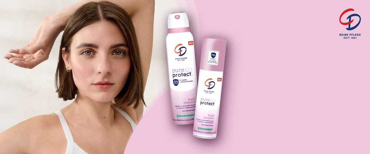Zwei rosa Deodorantdosen der Marke CD mit Aufschrift „pure protect“ und „fresh blossom“, links eine größere Sprühflasche mit „72h“ Symbol, rechts eine kleinere Sprühdose, rechts oben Logo „CD Reine Pflege Seit 1961“