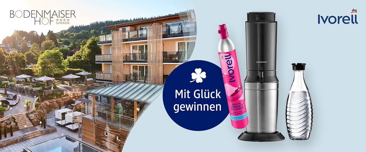 Werbeabbildung mit Text „Mit Glück gewinnen“, links Bergresort-Bild, rechts Ivorell Smoothie-Maker in Schwarz und Edelstahl, daneben eine pinke Ivorell-Gaskartusche und eine Glasflasche mit Wasser, oben rechts Logo „Ivorell“, oben links Schriftzug „Bodenmaiser Hof“