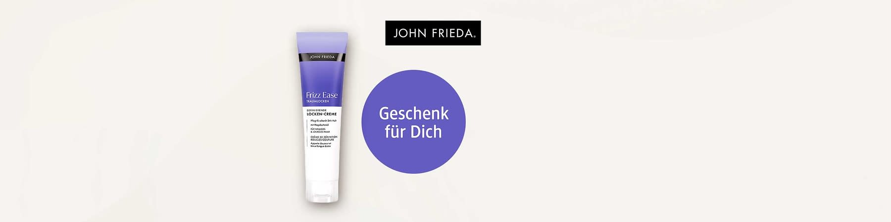 John Frieda Frizz Ease Locken-Creme in lila-weißer Tube links, rechts ein violetter Kreis mit weißer Schrift „Geschenk für Dich“, oben rechts schwarzes Logo „JOHN FRIEDA“