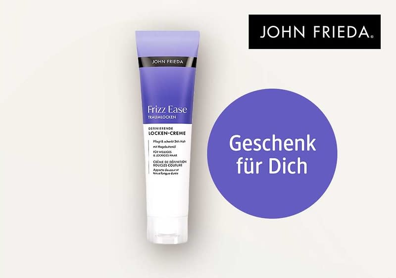 Tube John Frieda Frizz Ease Locken-Creme in lila-weißem Design, rechts daneben violetter Kreis mit weißem Text „Geschenk für Dich“ und oben rechts schwarzes John Frieda Logo