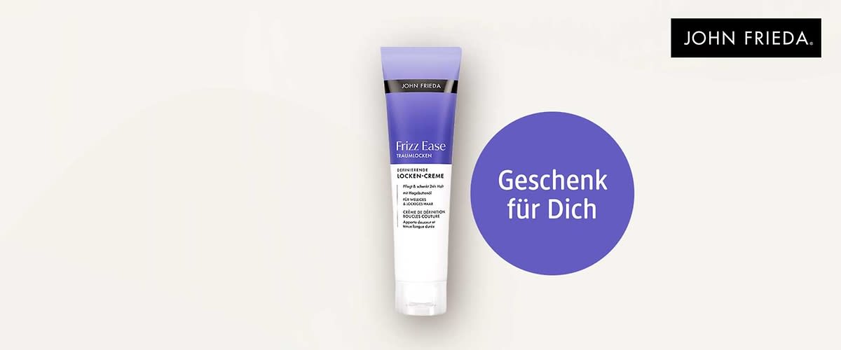 Tube John Frieda Frizz Ease Locken-Creme in lila-weißem Design, rechts daneben violetter Kreis mit weißem Text „Geschenk für Dich“ und oben rechts schwarzes John Frieda Logo