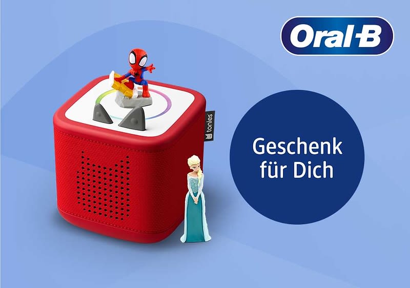 Rotes rechteckiges Tonie-ähnliches Hörspielgerät mit Spider-Man-Figur oben und Elsa-Figur an der Seite, daneben blaues Oval mit weißer Aufschrift „Geschenk für Dich“ und Oral‑B-Logo oben rechts