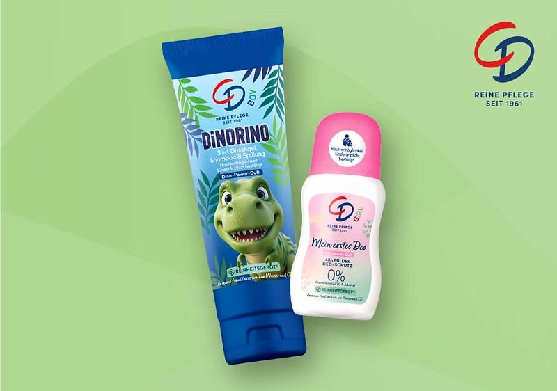zwei Kinderpflegeprodukte der Marke CD auf hellgrünem Hintergrund: links eine blaue Tube mit Dino-Illustration und Aufschrift „DiNORINO 3 in 1 Duschgel, Shampoo & Spülung“, rechts ein weißer Deo-Roller mit rosa Kappe und Aufschrift „Mein erstes Deo 48h milder Deo-Schutz 0% Aluminium & Alkohol“ und Markenlogo