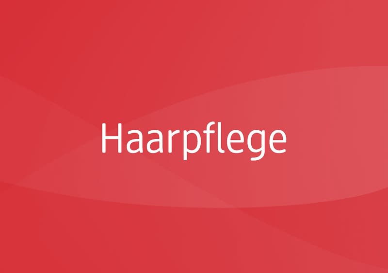 Das Wort "Haarpflege" auf rotem Grund