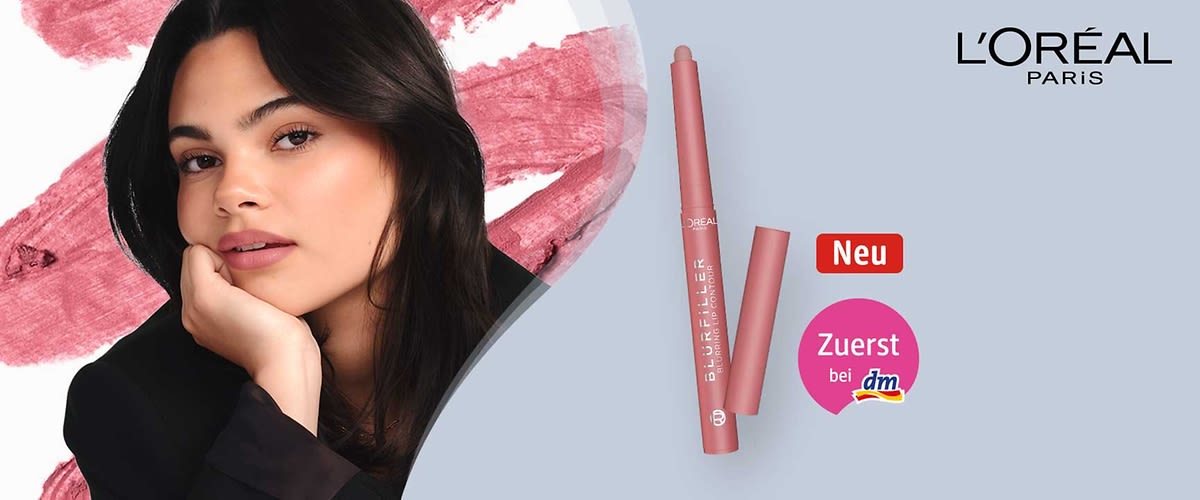 Werbung für L'Oréal Paris: Lippenkonturenstift in roséfarbener Stiftverpackung mit der Aufschrift „BLUR FILLER LIP CONTOUR“, daneben Porträt einer Frau mit dunklen Haaren und roséfarbenem Lippenmake-up, oben rechts Logo „L'ORÉAL PARIS“, rote Markierung „Neu“ und runder roter Button mit Text „Zuerst bei dm“