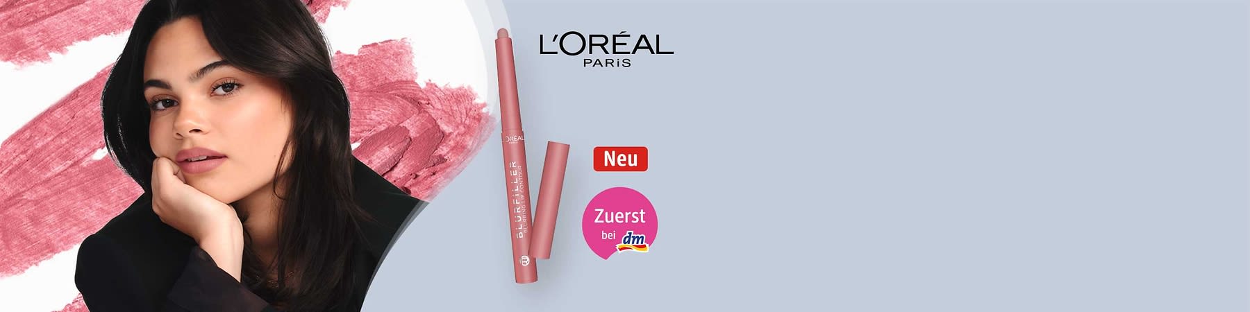 Porträt einer jungen Frau links und rechts eine rosafarbene L’Oréal Paris Lippenkonturenstift-Verpackung mit geöffnetem Stift, Logo „L’Oréal Paris“, roter Button „Neu“ und pinker Kreis mit Text „Zuerst bei dm“