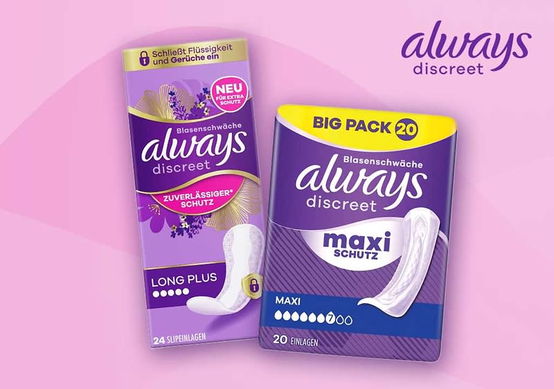 Zwei lilafarbene Always discreet Produktverpackungen auf rosa Hintergrund: links eine schlanke Packung „Long Plus“ mit 24 Slipeinlagen, rechts eine größere Packung „Maxi Schutz“ mit Aufdruck „Big Pack 20“ und Abbildung einer Einlage, oben rechts Logo „always discreet“