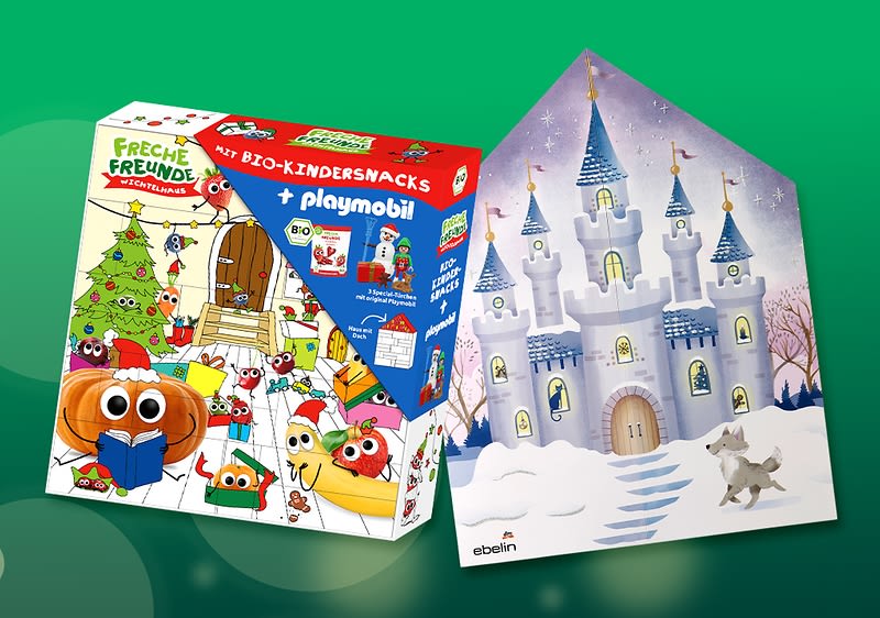 Zwei Adventskalenderverpackungen nebeneinander: links bunte Packung „Freche Freunde“ mit Cartoon-Gemüsefiguren und Aufschrift „mit Bio-Kindersnacks + playmobil“, rechts silbrig-violetter Kalender in Form eines Schlosses mit Tür, Fenstern, Sternenhimmel und kleinem Hund vor verschneiter Treppe