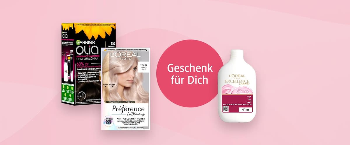 Auf einem rosa Hintergrund sind drei Produkte abgebildet: Links eine schwarze Verpackung von Garnier Olia mit der Aufschrift Ohne Ammoniak und Dunkelbraun 3.0, daneben eine Verpackung von L'Oréal Préférence Le Blonding mit einem verschwommenen Gesicht und der Aufschrift Toner, rechts eine weiße Flasche L'Oréal Excellence mit der Aufschrift Pflegende Farbspülung 3, in der Mitte ein roter Kreis mit dem Text Geschenk für Dich