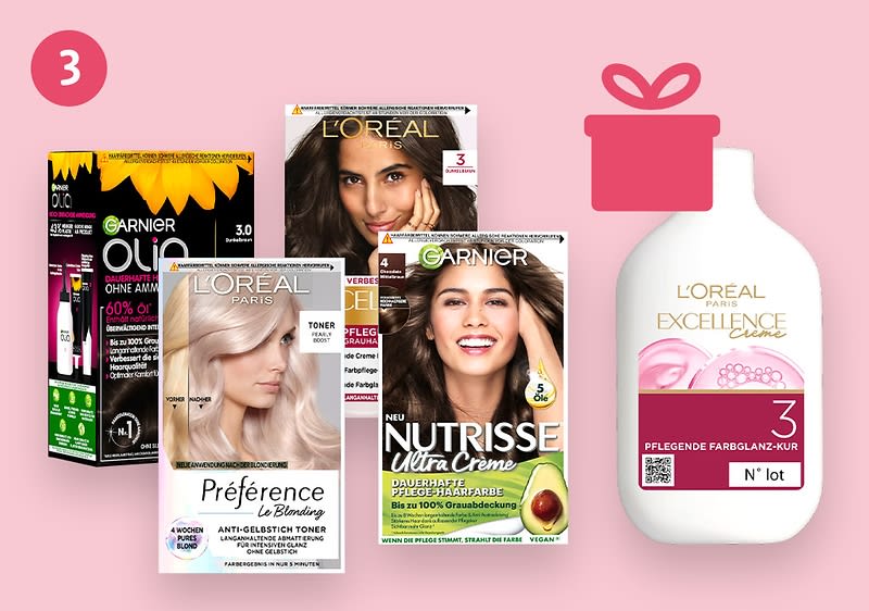 Eine Collage auf rosa Hintergrund zeigt fünf Haarfärbemittel-Verpackungen und ein Geschenk-Symbol: Links oben Garnier Olia mit schwarzer Verpackung und gelber Schrift, daneben L'Oréal Préférence mit silberner Verpackung und der Aufschrift Anti-Gelbstich Toner, rechts daneben Garnier Nutrisse Ultra Creme mit grüner Verpackung und einem Avocado-Bild, rechts außen L'Oréal Excellence mit weißer Verpackung und der Aufschrift Pflegende Farbglanz-Kur N° 1, die Gesichter auf den Verpackungen sind unscharf.