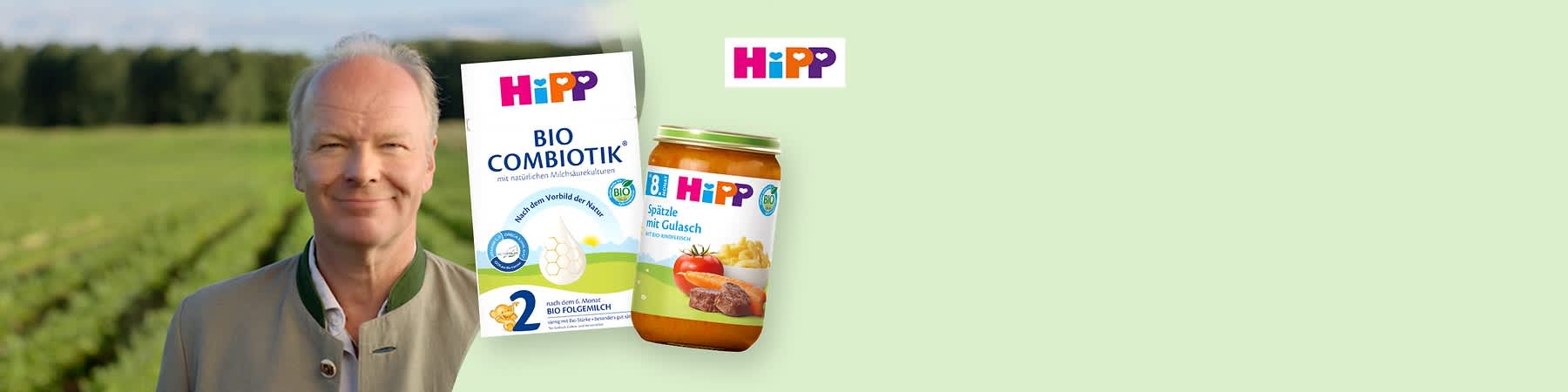 Eine Packung Hipp Bio Combiotik Folgemilch mit der Aufschrift „Bio Combiotik mit natürlichen Milchsäurekulturen“ und ein Glas Hipp Spätzle mit Gulasch. Oben rechts das Hipp Logo