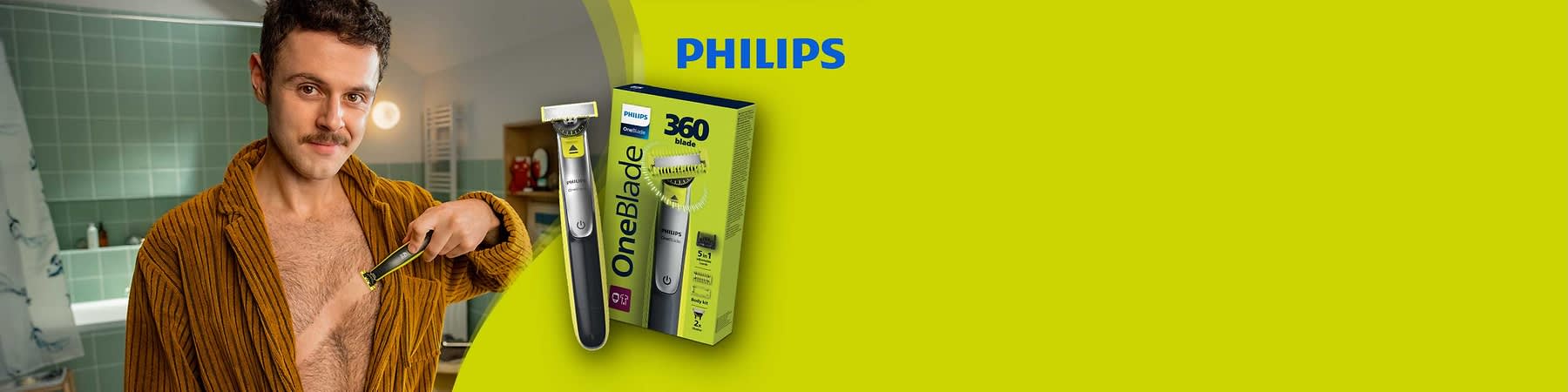 Philips OneBlade Elektrobehaarungsgerät mit schwarzem Griff neben grüner Produktverpackung mit Aufdruck „OneBlade“ und „360 blade“, rechts oben blaues Philips-Logo