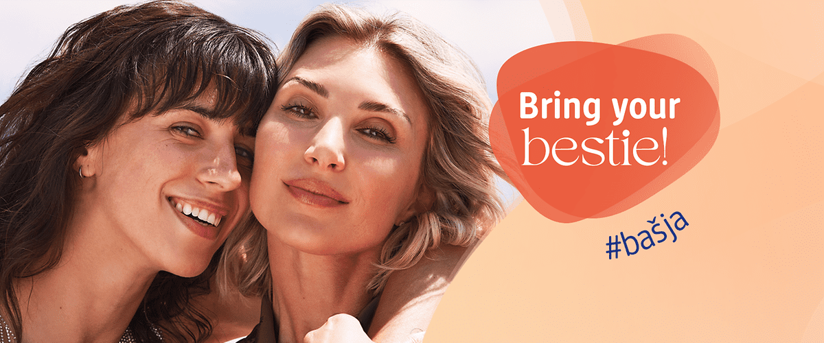 Slika koja prikazuje dvije prijateljice koje se smiju uz natpis Bring your bestie
