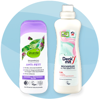 Shampoo antigrasso alverde e ammorbidente Denkmit su sfondo blu sfumato