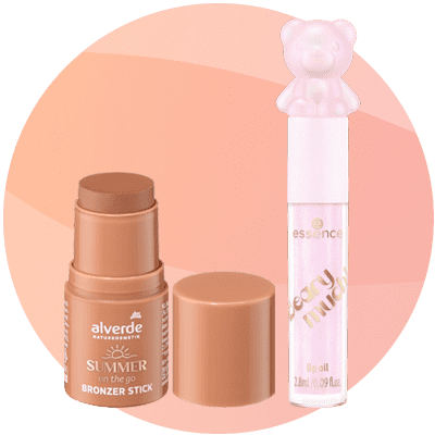 Cosmetici: bronzer stick marrone e gloss labbra rosa con tappo a forma di orsacchiotto