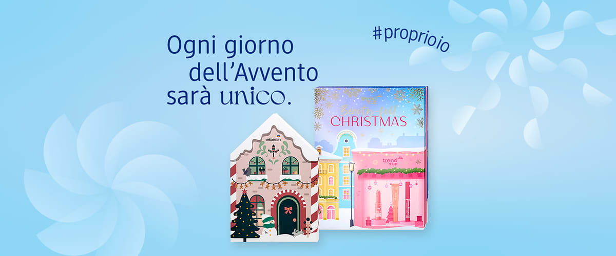 Calendari dell'Avvento a marchio dm con case colorate e scritta Ogni giorno dell'Avvento sarà unico