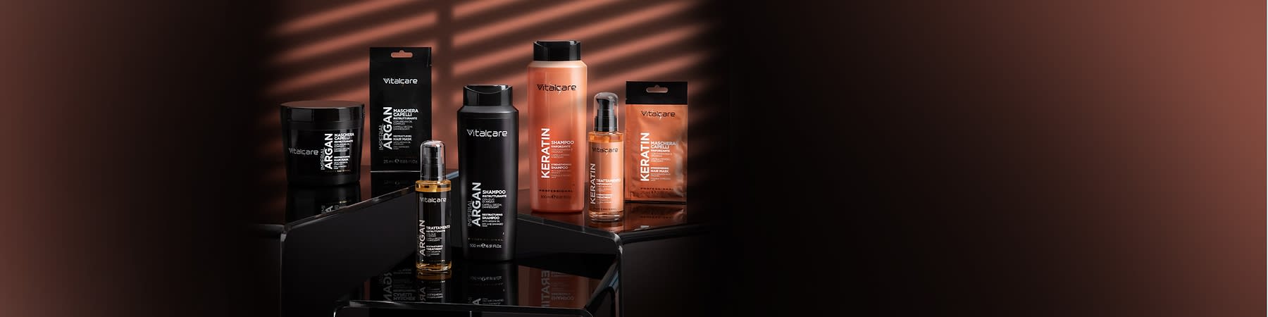 Linea prodotti per capelli Vitalcare con argan e cheratina su sfondo scuro