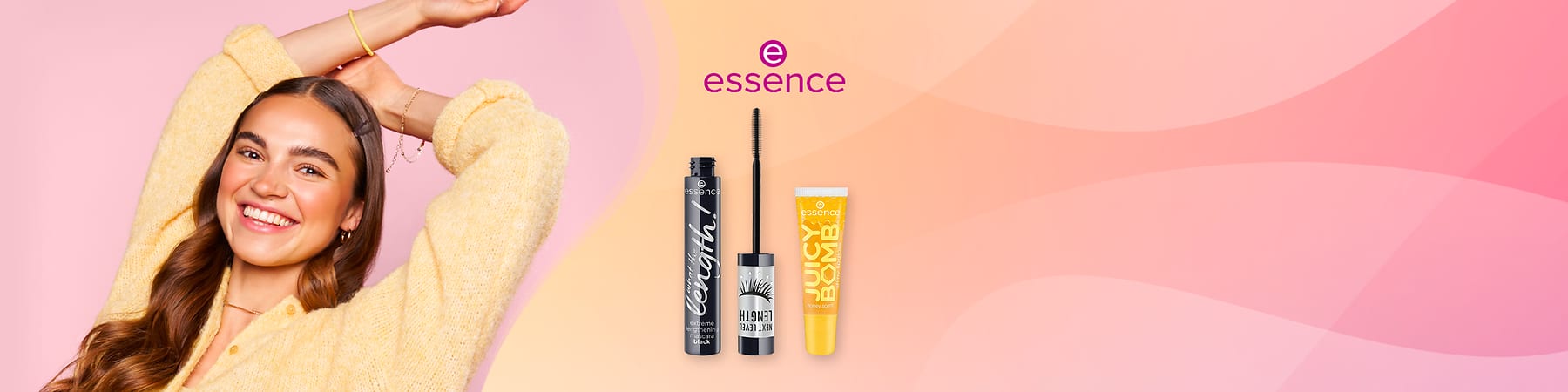 Prodotti essence su sfondo sfumato rosa e pesca