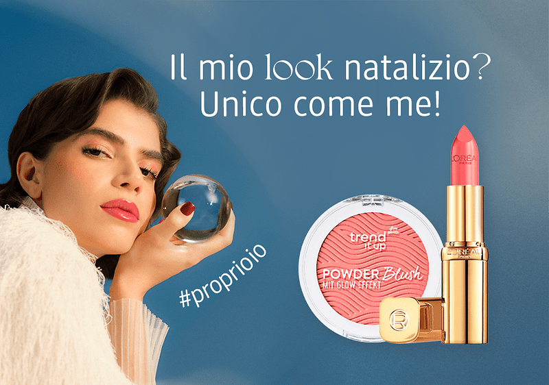 Ragazza castana con look da festa tiene una sfera di vetro in mano. Sulla destra ci sono in primo piano due prodotti make-up: blush rosa trend it up e rossetto L'Oreal Paris.