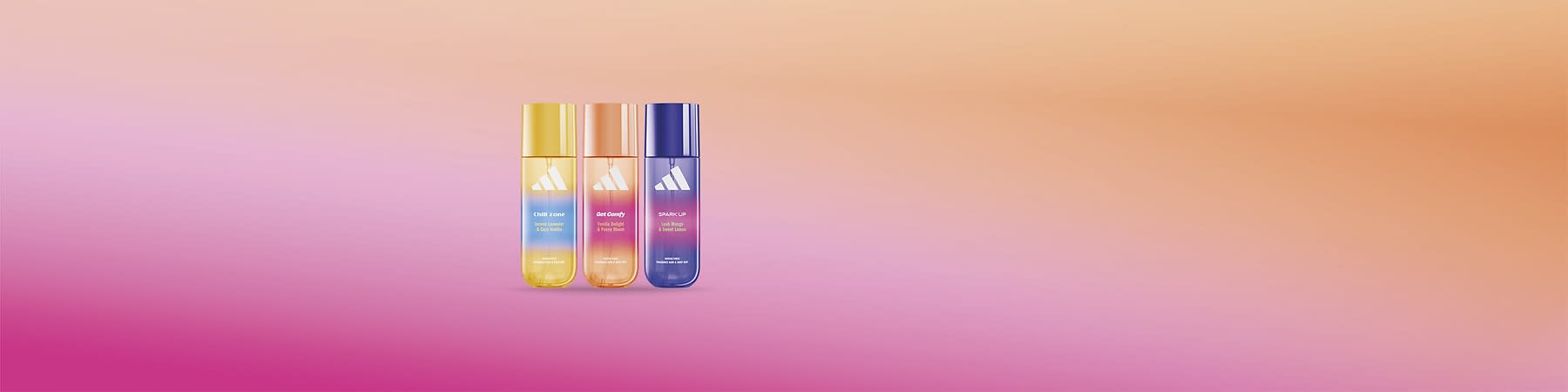 Profumi Adidas colorati su sfondo sfumato rosa e arancione