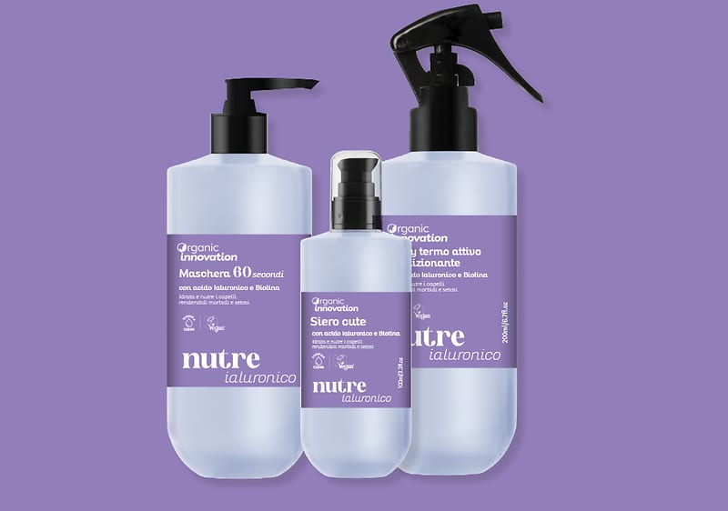 Prodotti per capelli Organic Innovation con acido ialuronico su sfondo viola