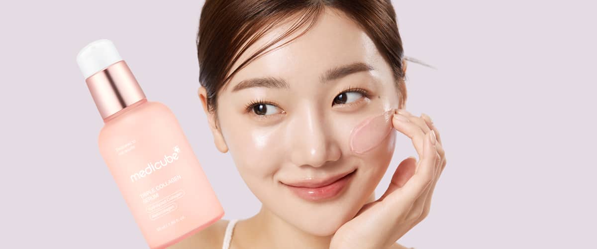 Flacone di tonico Medicube su sfondo rosa