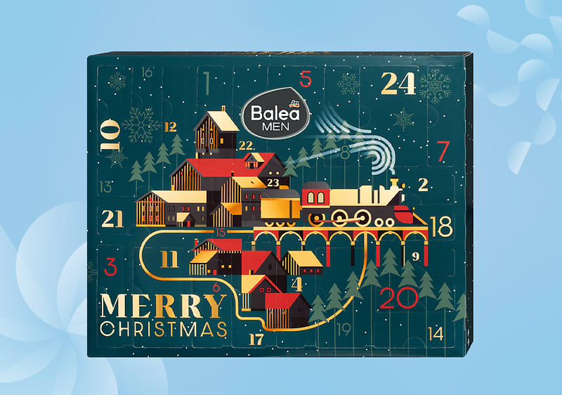 Calendario dell'avvento Balea Men con treno e case natalizie su sfondo azzurro
