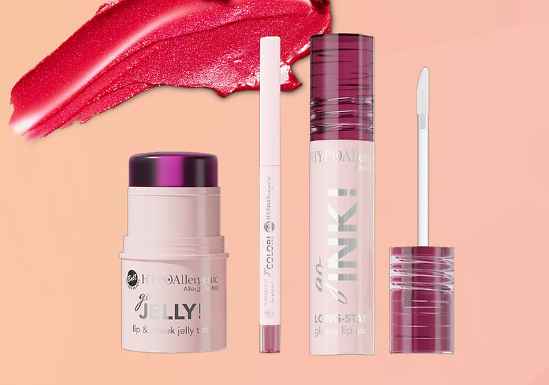 Prodotti make-up a marchio Bell HYPOAllergenic su sfondo rosa sfumato con elemento grafico di rossetto che cola