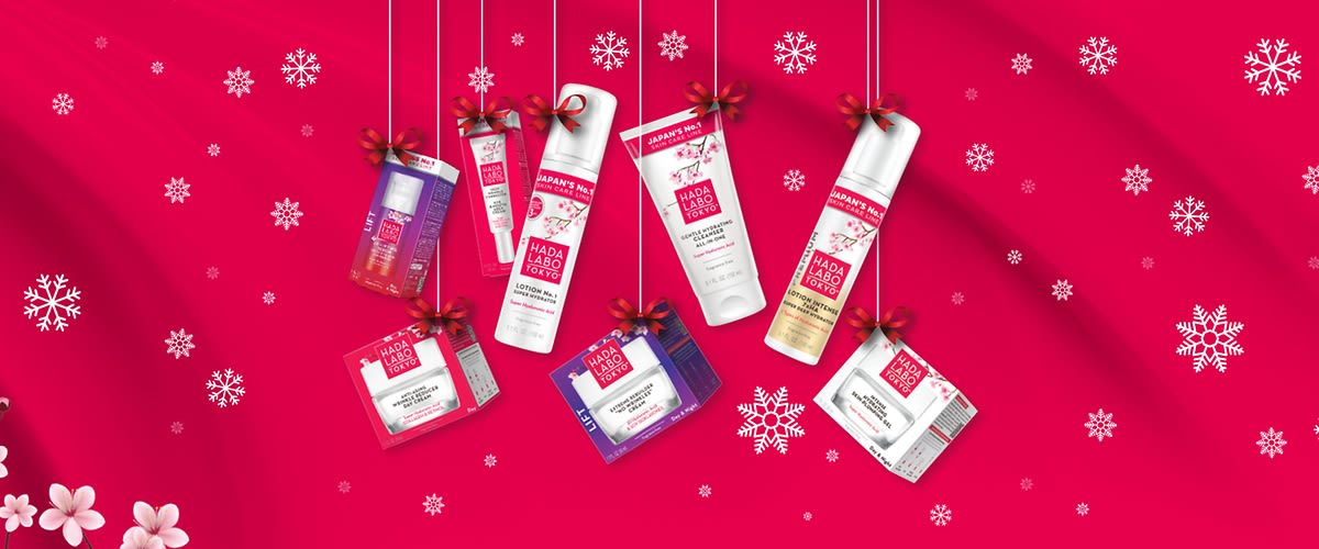 Prodotti skincare HADA LABO TOKYO su sfondo rosso con fiori e fiocchi di neve
