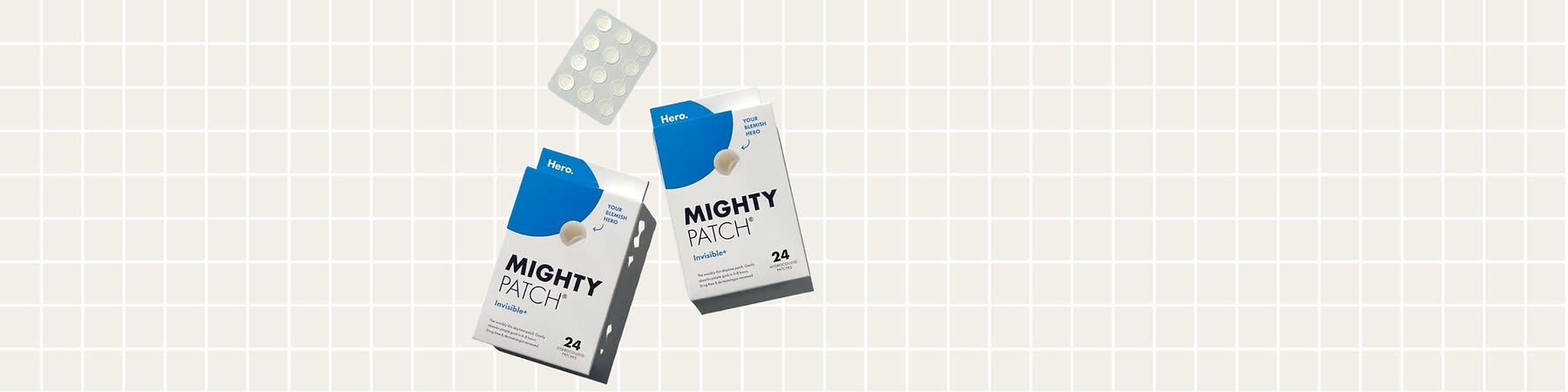 Confezioni di cerotti Mighty Patch su sfondo a griglia