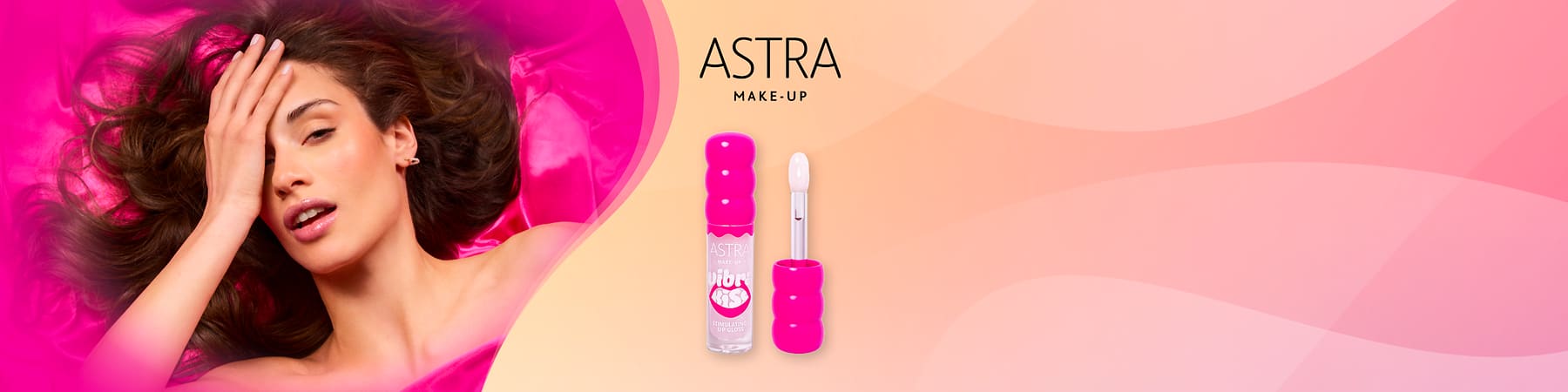 VibraKiss di ASTRA MAKE-UP con applicatore vicino a donna con capelli castani