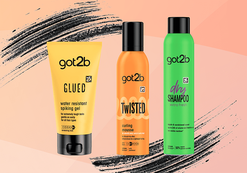 Tre prodotti got2b su sfondo rosa: gel Glued, mousse Twisted e dry shampoo.