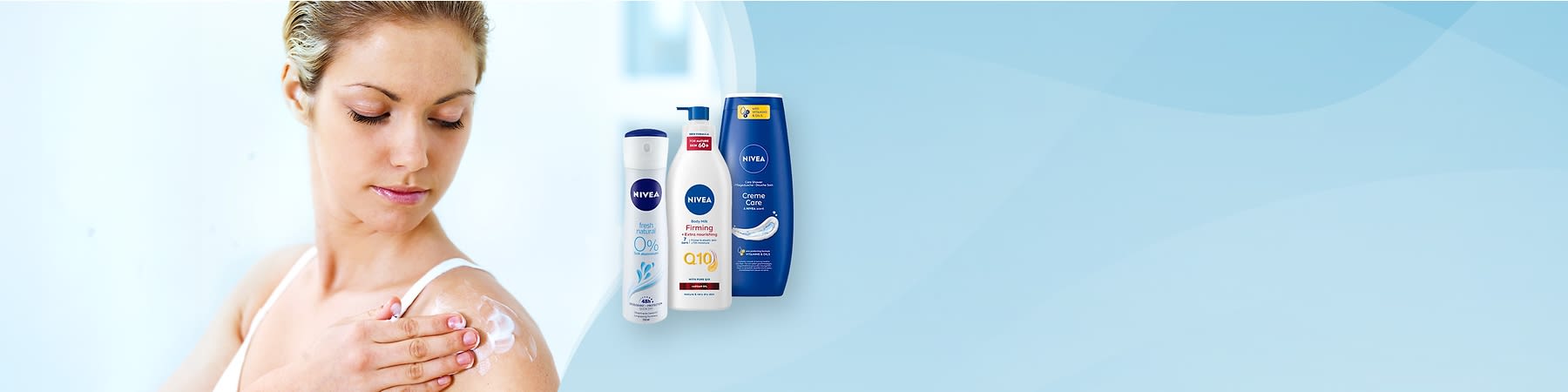 Kobieta nakłada krem na ramię obok grupy produktów do pielęgnacji skóry marki Nivea.