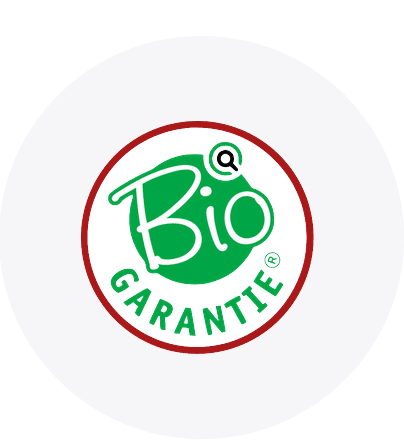 Sigla Bio Garantie pe fundal alb cu cerc verde și text roșu