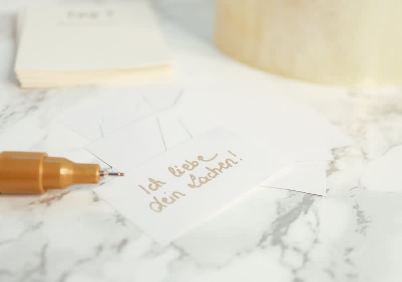 Kompliment auf Zettel geschrieben