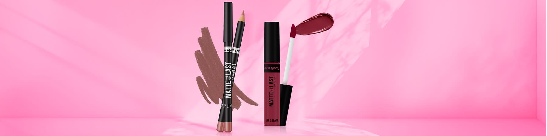 Ruj lichid pe fundal roz