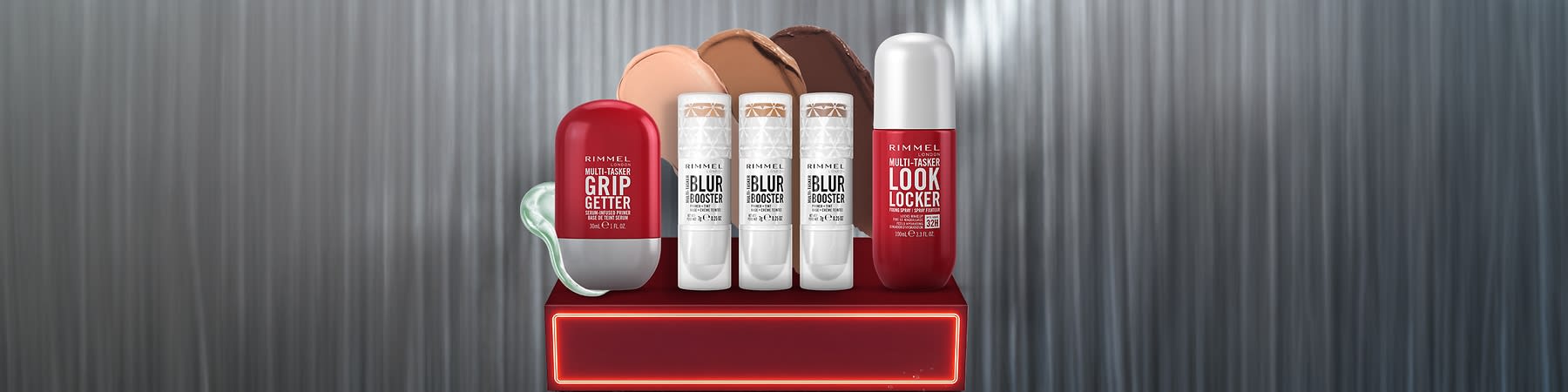 Recipient rimmel roșu și alb pe suport cu background gri texturat