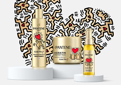 Produse Pantene cu design Keith Haring și inimă roșie pe fundal alb